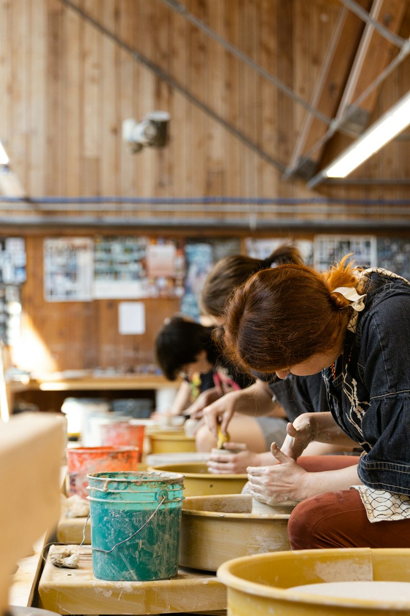 Women working on pottery at a workshop